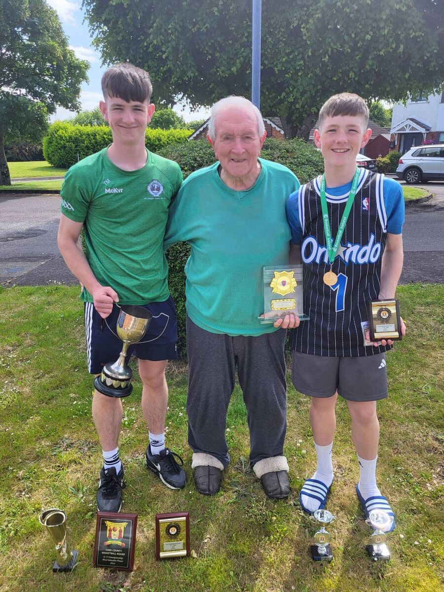 Eddie Hogan and his great-grandsons Tadhg Murphy and Daithí Murphy following a successful season with Ballincollig Basketball Club.