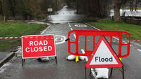 Road closed and flood sign