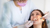 Dentist and patient in dentist office