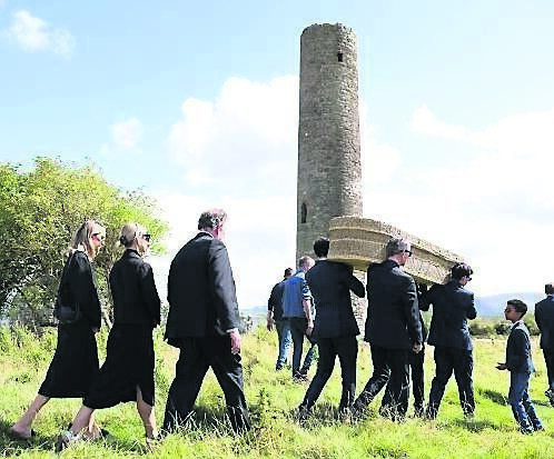 Edna O’Brien's coffin being taken to its final resting place in Mountshannon, Co Clare, last year;