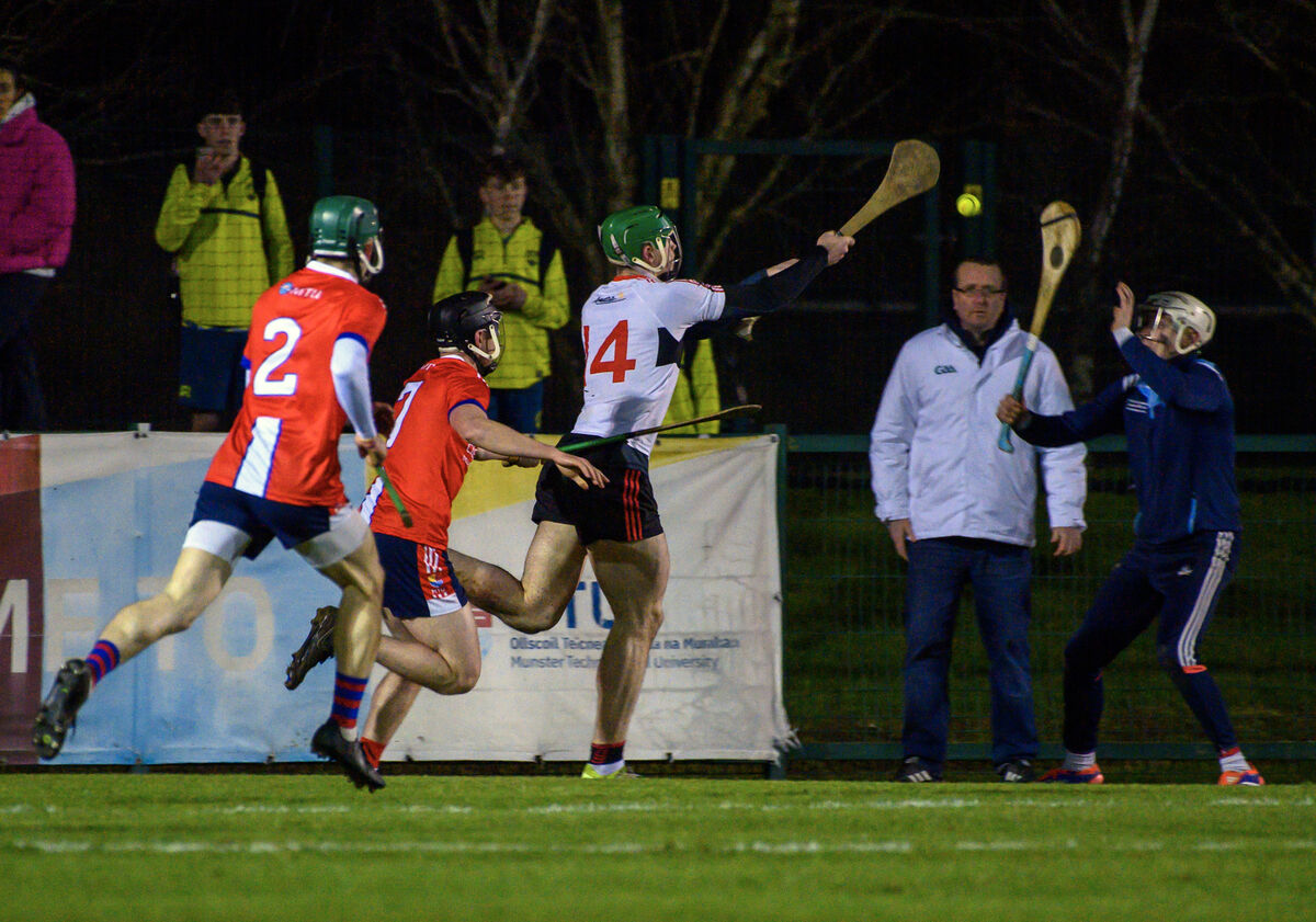 Fionn Coleman, UCC hits the sliotar ofver MTU keeper Cathal Wilson in the Electric Ireland HE GAA Fitzgibbon Cup at MTU, Bishopstown, Cork. . Picture Dan Linehan Fionn Coleman, UCC hits the sliotar ofver MTU keeper Cathal Wilson in the Electric Ireland HE GAA Fitzgibbon Cup at MTU, Bishopstown, Cork. . Picture Dan Linehan