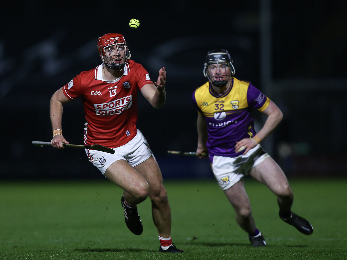 Cork’s Brian Hayes with his eyes on the ball, trailed by Wexford’s Conor Foley, during last week's Allianz HL Division 1A game at Chadwicks Wexford Park. Picture: Inpho/Ken Sutton