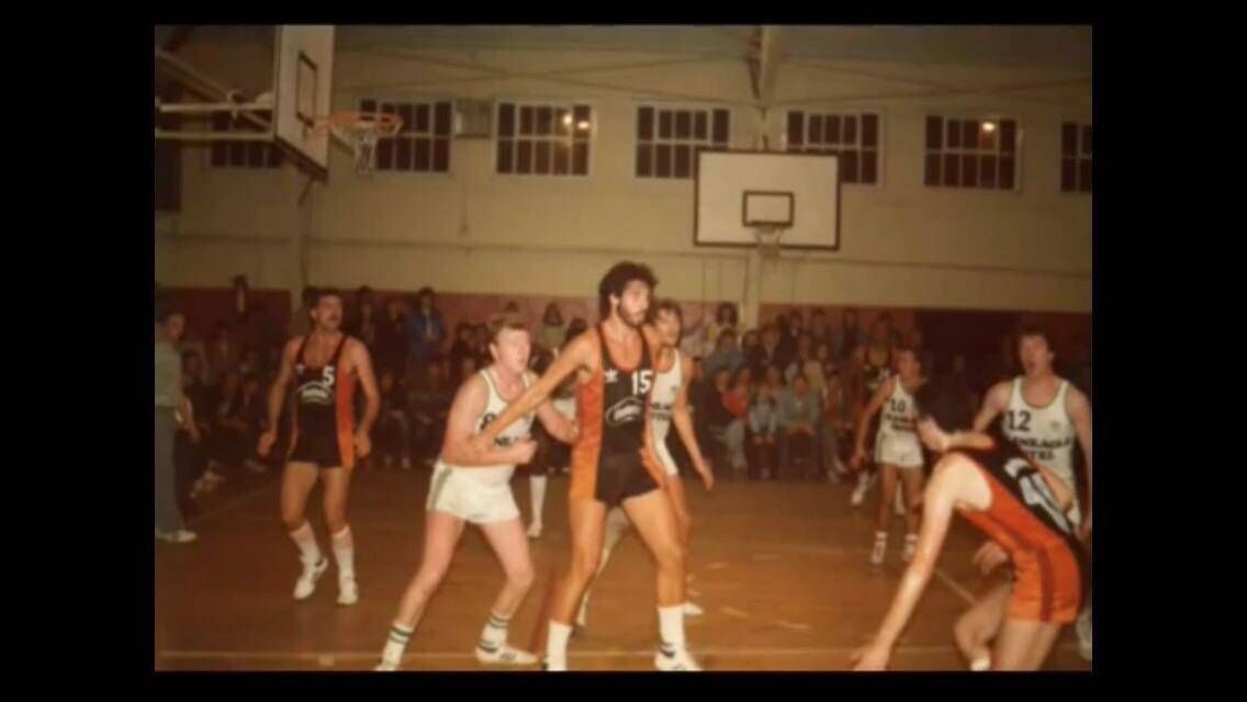 Britvic's Mono McCarthy dribbles the ball while American Steve Isaacs gets into position against Killarney at the Parochial Hall
