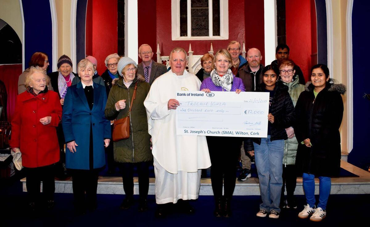 Fr Michael O'Leary pictured presenting a cheque to the value of €12,000 to Trócaire’s centre and volunteer officer Janet Twomey alongside parishioners of Wilton. Picture: Michael English Fr Michael O'Leary pictured presenting a cheque to the value of €12,000 to Trócaire’s centre and volunteer officer Janet Twomey alongside parishioners of Wilton. Picture: Michael English