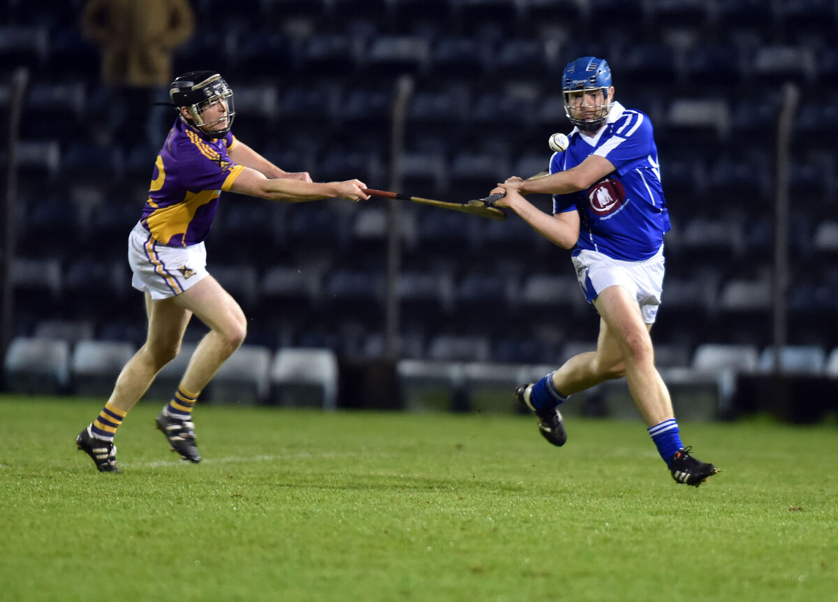St Catherine's Shane Cotter hooks Brian Dillon's John Horgan. Picture: Eddie O'Hare