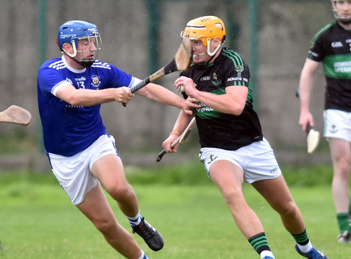 Nemo Rangers' Conor O'Donovan breaks from Brian Dillon's John Horgan. Picture: Eddie O'Hare