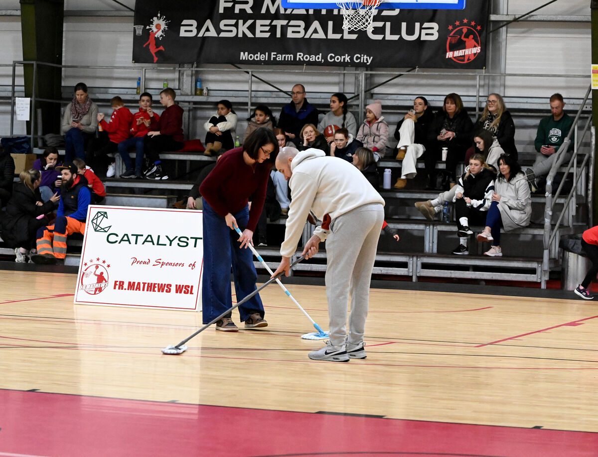 Volunteers mopping the floors before the Super League game at Fr Mathew Arena was called off. Picture: Eddie O'Hare