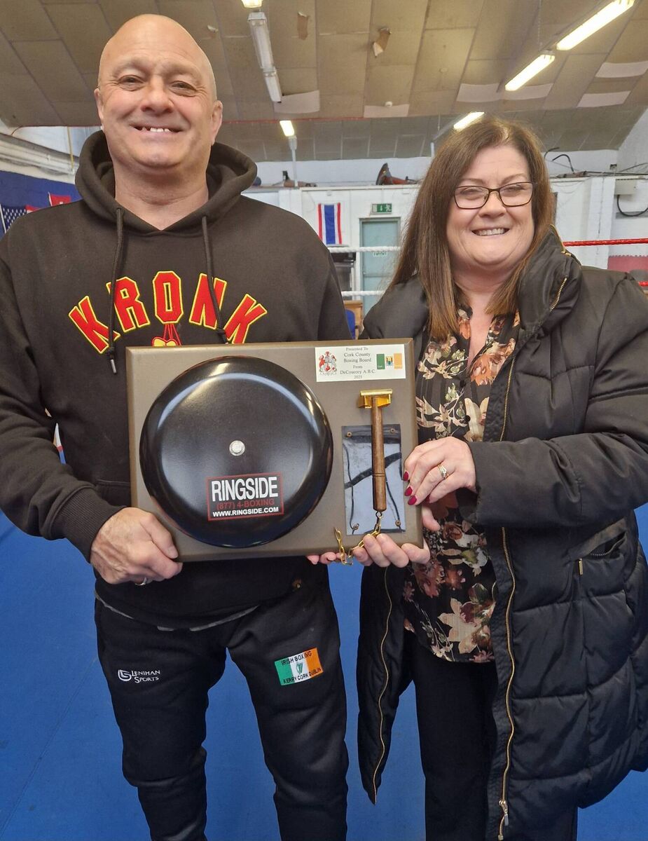 Cork Boxing: Will Rossall presenting County Board Timekeeper Rose Murphy with the new bell, kindly sponsored by the De Courcey Boxing Club. Cork Boxing: Will Rossall presenting County Board Timekeeper Rose Murphy with the new bell, kindly sponsored by the De Courcey Boxing Club.