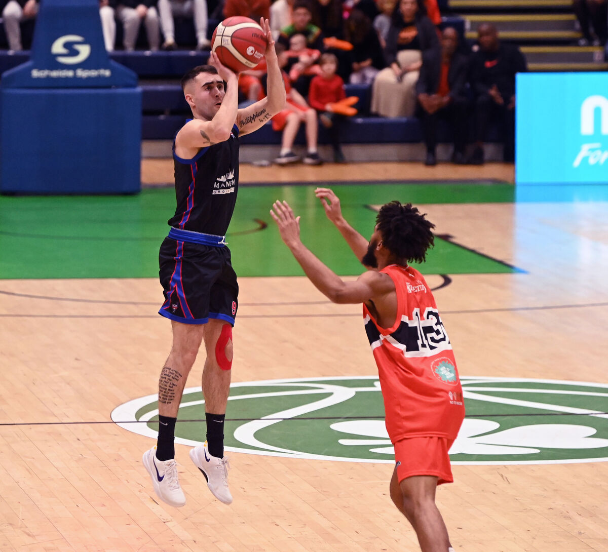 UCC Demons' E James Hannigan shoots from Killester's Isiah Dasher during the Pat Duffy national cup final at the National Basketball Arena, Tallaght. Picture: Eddie O'Hare UCC Demons' E James Hannigan shoots from Killester's Isiah Dasher during the Pat Duffy national cup final at the National Basketball Arena, Tallaght. Picture: Eddie O'Hare
