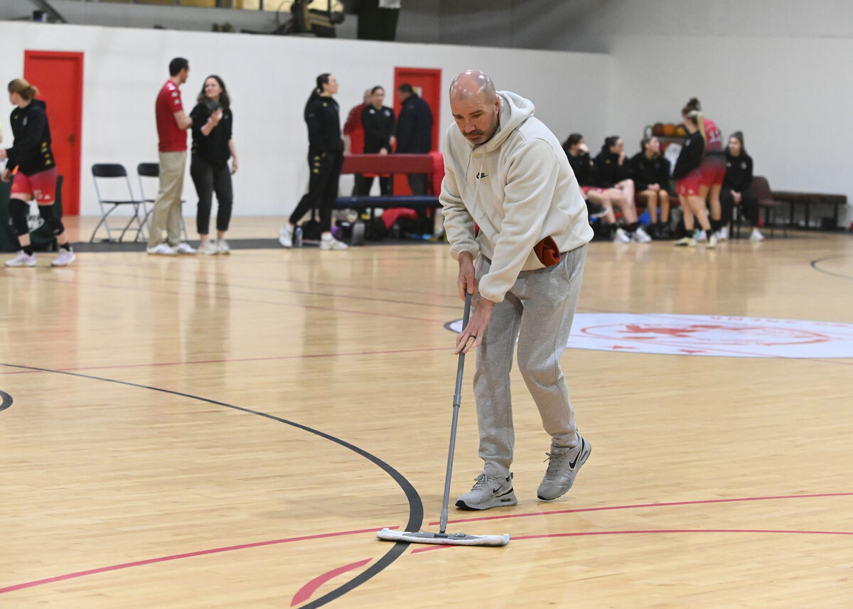 Volunteers mopping the floors during the abandoned game between Catalyst Fr. Mathew's and Trinity Meteors. Picture: Eddie O'Hare Volunteers mopping the floors during the abandoned game between Catalyst Fr. Mathew's and Trinity Meteors. Picture: Eddie O'Hare