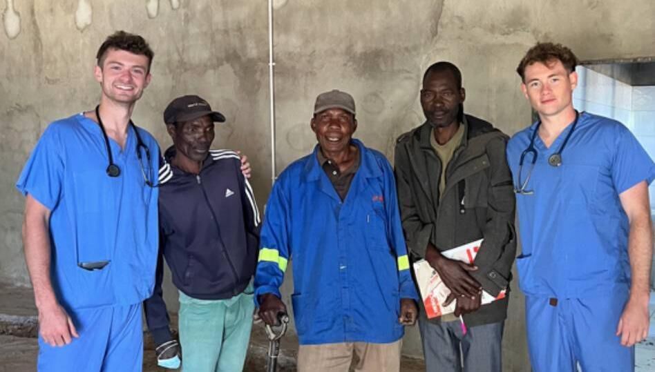  Peter Macilwrith (left) and Gearoid Morgan O'Brien (right) with the labourers at St Joseph's Mission Hospital Zambia. Surgeon Noonan Society donated €28,000 to St Joseph’s Mission Hospital in Lubwe, Zambia.