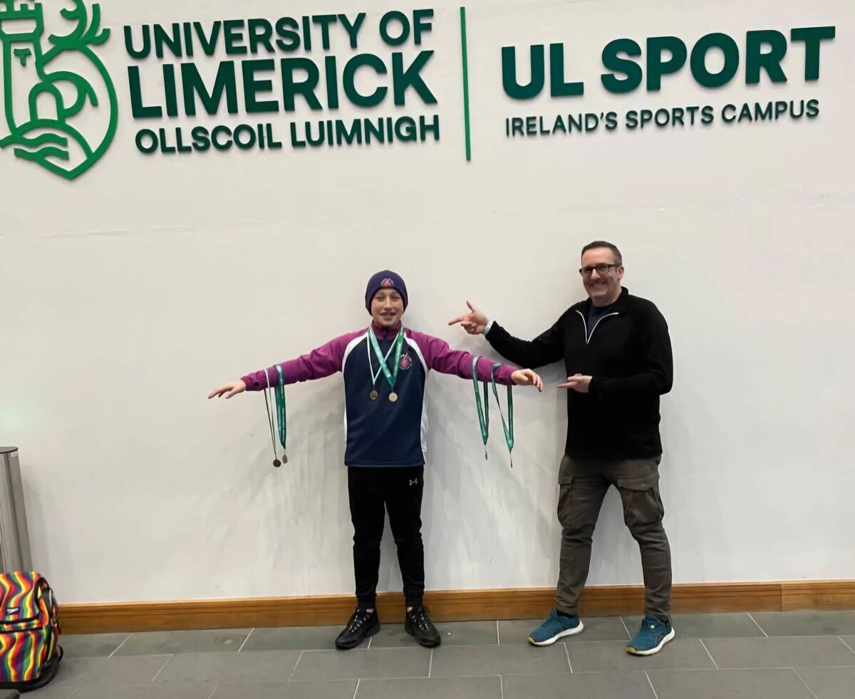 Cork Swimming: Cillian Turner, winner of eight gold medals at the Gerry Ryan Memorial Meet, with coach Marc Sanquest, Picture: Streamline Swimming Club. 
