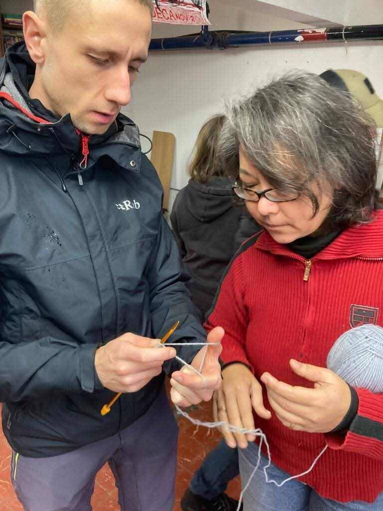 K teaching Paul how to knit at a Cork Repair Café event. K was prompted to develop the idea for the project as a result of her own experiences around trying to source repair shops locally.