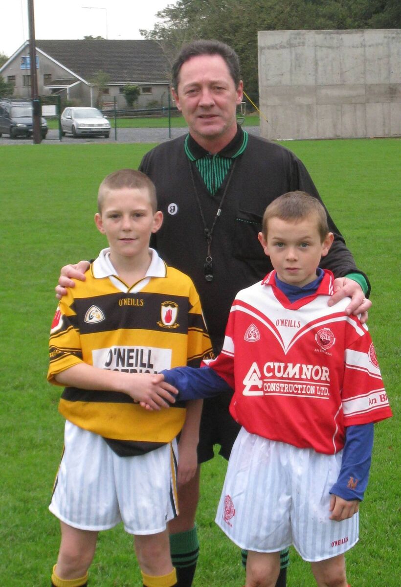 Referee Michael Corcoran with on left, Ciaran Hanifin, Na Piarsaigh and Mark Coleman, Blarney at the Garda U11 Hurling League finals in 2008. Referee Michael Corcoran with on left, Ciaran Hanifin, Na Piarsaigh and Mark Coleman, Blarney at the Garda U11 Hurling League finals in 2008.