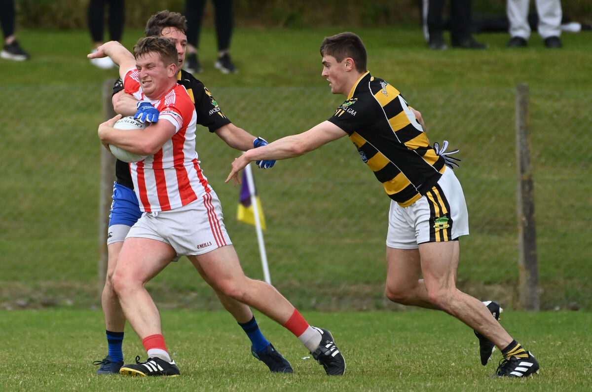 Imokilly's Charlie Terry is tackled by Avondhu's Brian Guerin and Will Foughy in 2022. Picture: Eddie O'Hare Imokilly's Charlie Terry is tackled by Avondhu's Brian Guerin and Will Foughy in 2022. Picture: Eddie O'Hare