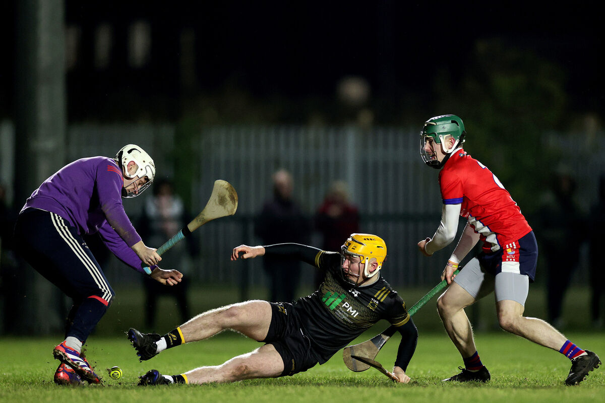 TUS Midwest's Sean Kenneally tries to get by  MTU Cork's goalkeeper Cathal Wilson, while Fionn O'Connell tries to stop him. Picture: ©INPHO/Laszlo Geczo