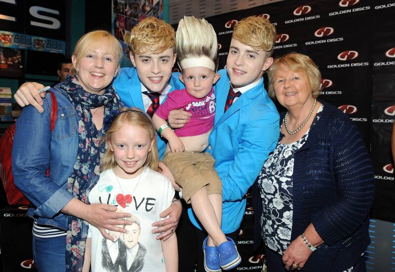 Valerie Fitzgerald with her children Sarah and Cillian from Kinsale and her mother Marie Twomey from Dublin Hill meet Jedward at Golden Discs in Mahonpoint. Picture: Eddie O'Hare