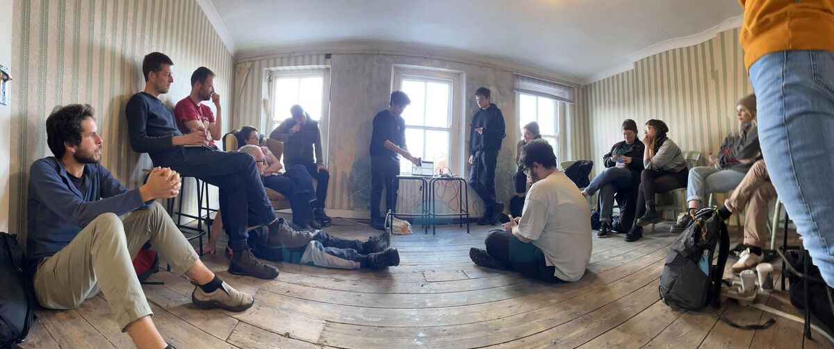 Members of the Éist team attend an early meeting on its tech setup.