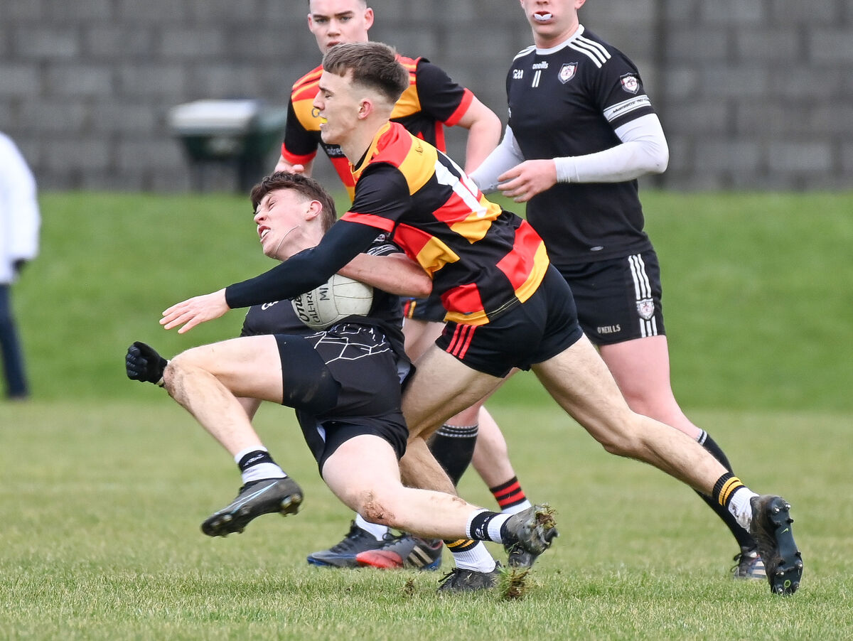  Midleton's Cathal Beausang is tackled by St Colman’s Mark O'Dwyer. Picture: David Keane.