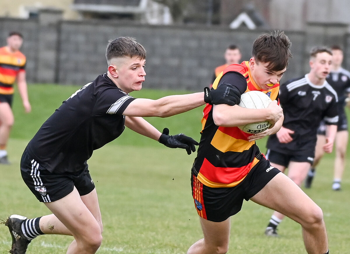  St Colman’s Charlie O'Dwyer tries to get away from Midleton's Matthew McSweeney. Picture: David Keane.