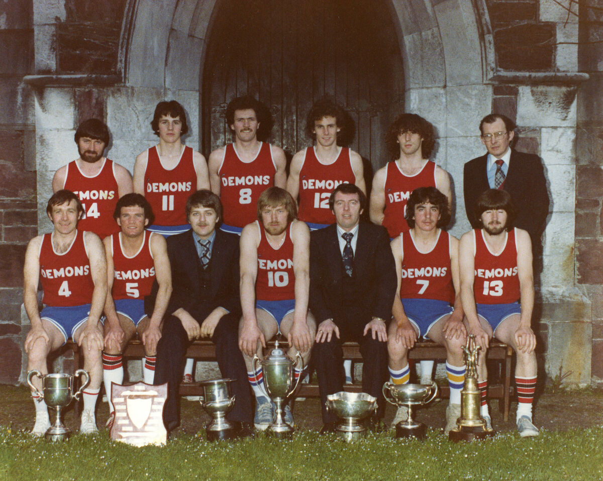 The Blue Demons 1979/80 senior team that captured an array of trophies. Back: Peter Coughlan, Timmy McCarthy, Tom Wilkinson, Gerry Wheeler, Pat Collins, Michael O’Sullivan. Front: Sean Murphy, Denis Caffrey, Bill Ramsell, Andrew Houlihan, Dan Byrne, William (Mono) McCarthy, Joe Coughlan