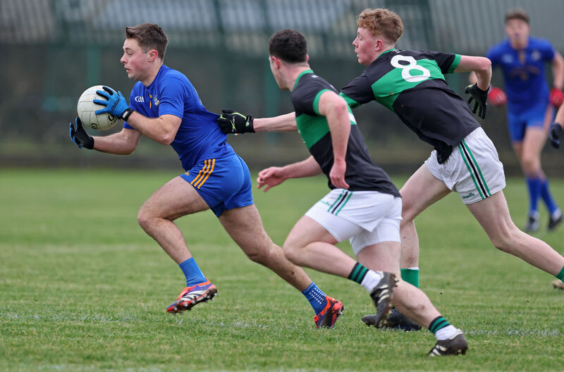  William Buckley, St Finbarr's, has his shirt pulled by Billy O'Neill, Nemo Rangers. Picture: Jim Coughlan.