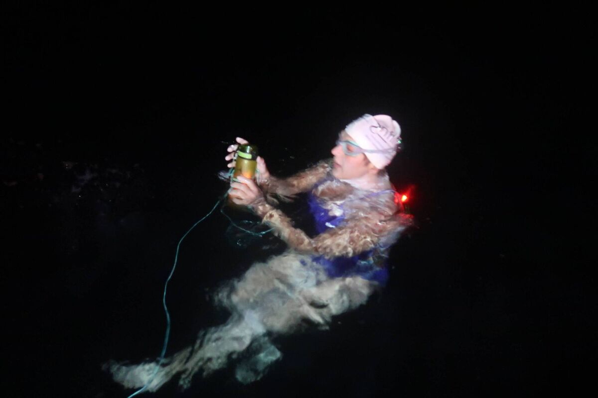 Olga O'Sullivan feeding herself in the dark during the Dal Riata Channel swim.