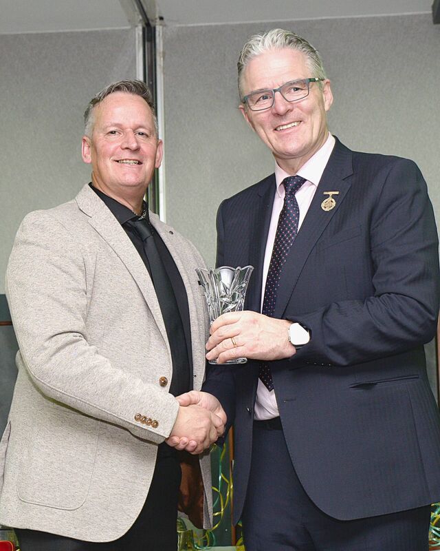 Cormac Linehan, Kilmurry's Premier Junior football manager, being presented with a token of appreciation from Jarlath Burns, President of the GAA. Picture: Peter Scanlan Photography 