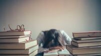 Student Studying Sleeping on Books