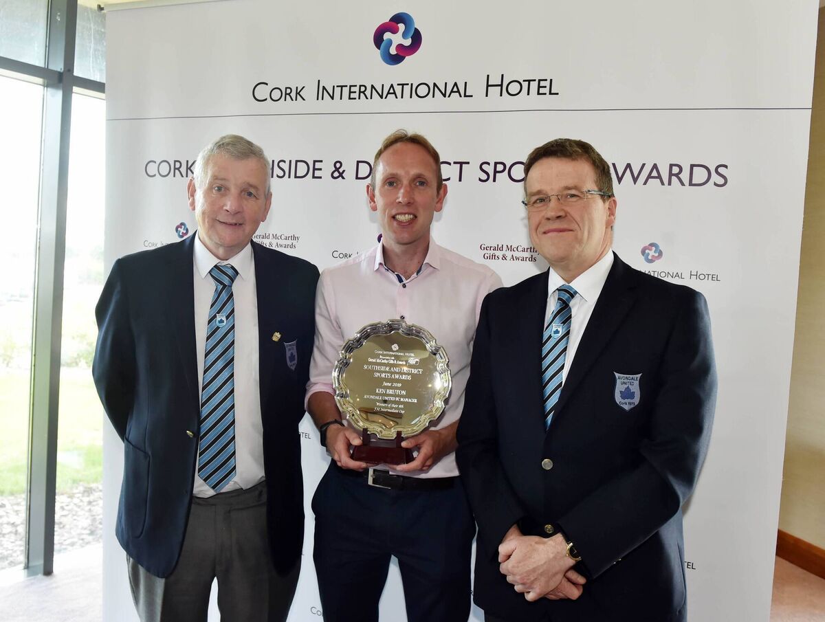 Avondale United manager Ken Bruton, winner of the Cork International Hotel Sportstar of the Month for May, with club PRO Noel Long, left, and club chairman Dave Madden.