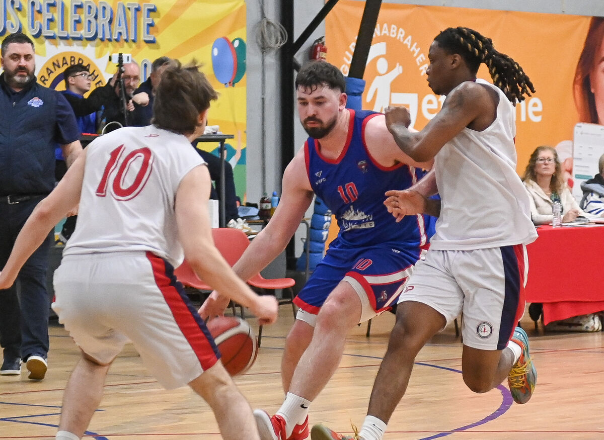  UCC Demons' David Lehane is challenged by Templeogue's Daniel Cassidy and Jacolbey Owens, during their Men's Super League clash at the Parochial Hall. Picture: David Keane.