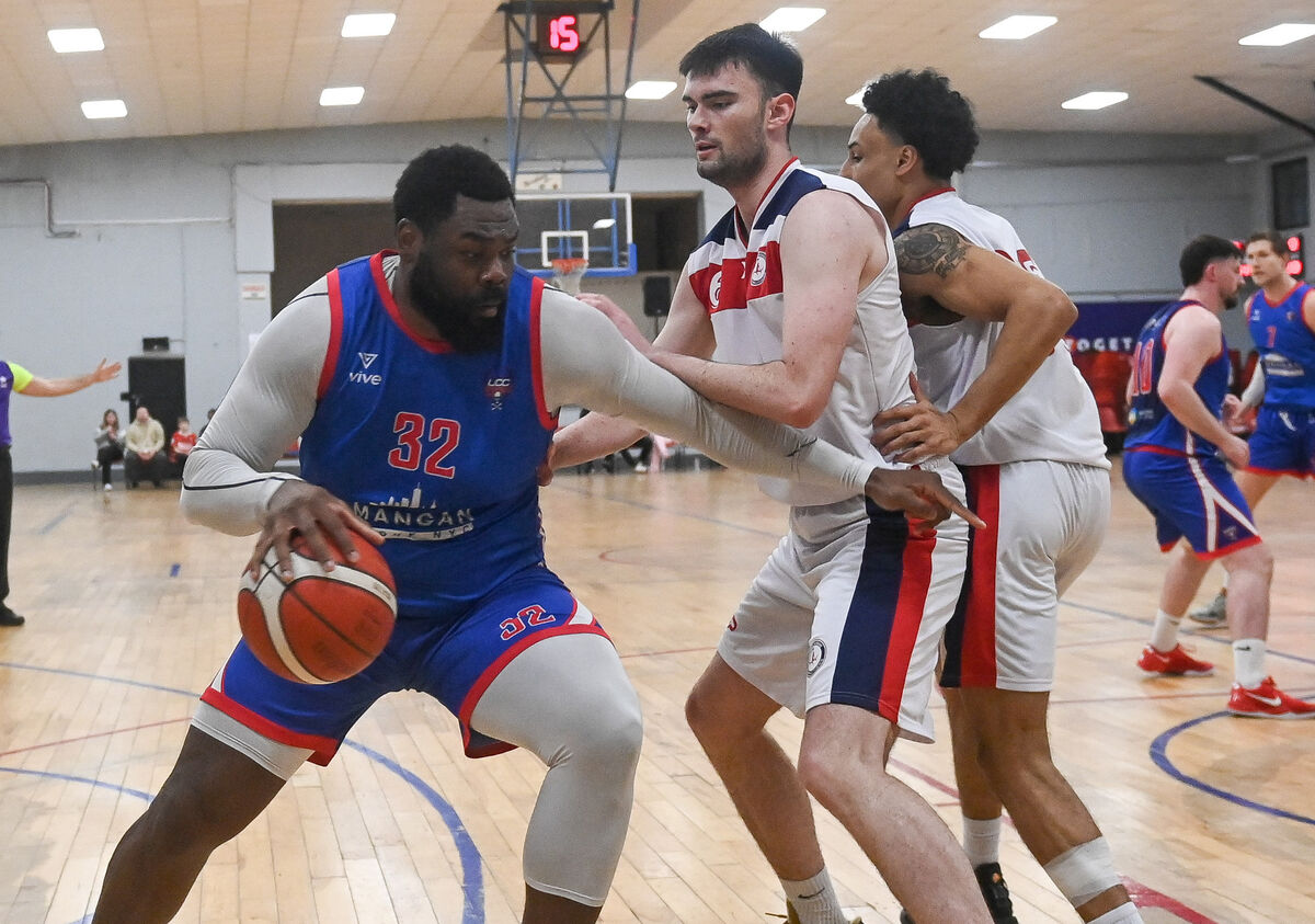  UCC Demons' Elijah Tillman is challenged by Templeogue's Callum McGrail. Picture: David Keane.