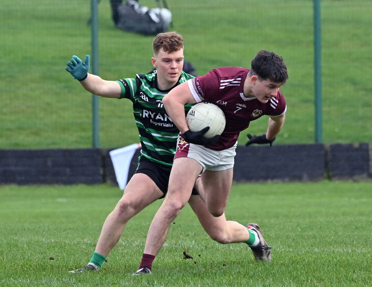  Sean O'Leary, Douglas getting in a tackle on Odhran Foley, Bishopstown. Picture Dan Linehan