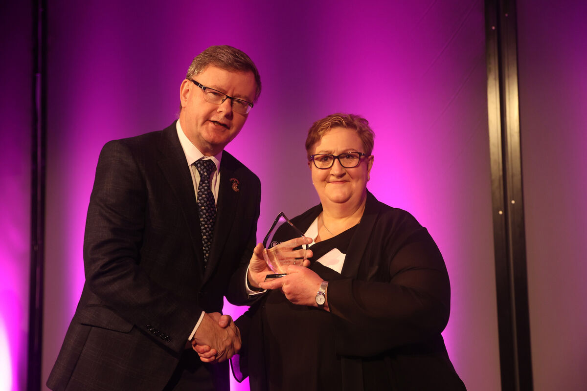 President of the Camogie Association Brian Molloy presents the Camogie Association 2025 Volunteer of the Year Award for Cork to Sarsfields Lilian Zinkant. President of the Camogie Association Brian Molloy presents the Camogie Association 2025 Volunteer of the Year Award for Cork to Sarsfields Lilian Zinkant.