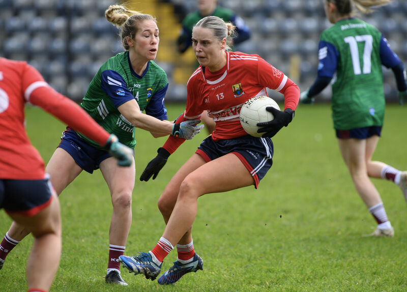  Laura O'Mahony is held by Ayesha Roche, Westmeath, during their Lidl National Football League Division 2 match at Páirc Uí Rinn. Picture: Dan Linehan
