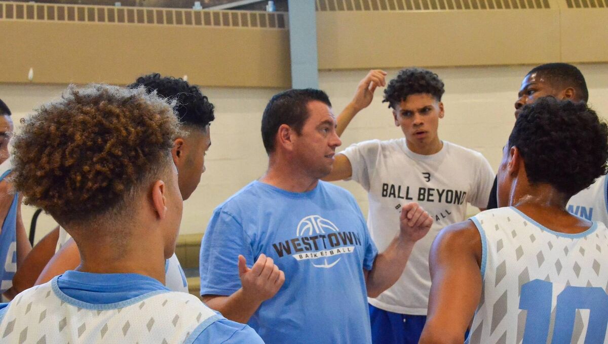 ﻿Basketball coach Paul Manning giving instructions to his Westtown High School Team. In the photo is Cam Reddish on the right, who now plays with the LA Lakers in the NBA.