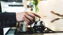 A man ringing the reception bell