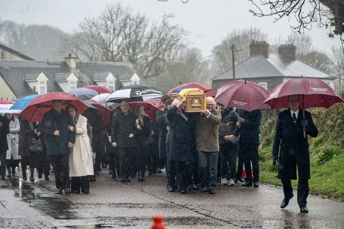 Friends and family carry the coffin of Michael O'Sullivan’s during his funeral procession in Lombardstown, Co Cork. Picture Chani Anderson