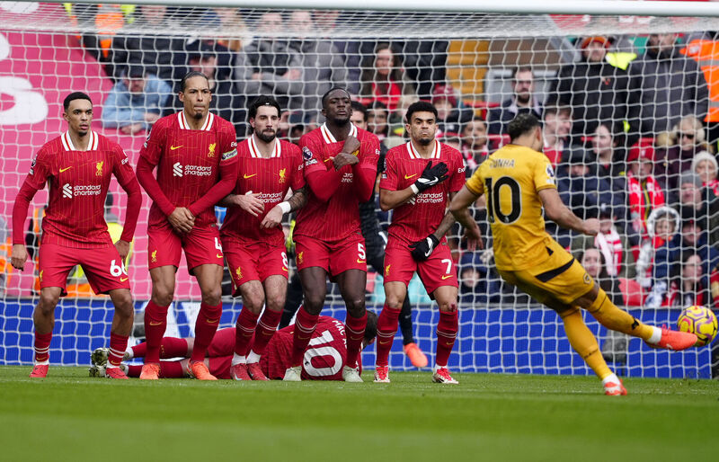 Wolverhampton Wanderers' Matheus Cunha has an attempt on goal from a free kick during the Premier League match at Anfield, Liverpool. Picture: Peter Byrne/PA Wire