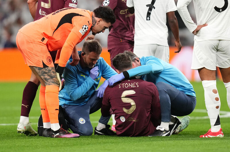 Manchester City's John Stones receives treatment before leaving the game with an injury at the Santiago Bernabeu, Madrid. Picture: John Walton/PA Wire.