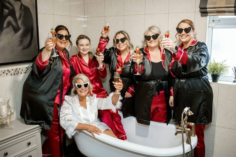 Clodagh having fun with her bridesmaids before the couple’s wedding ceremony.