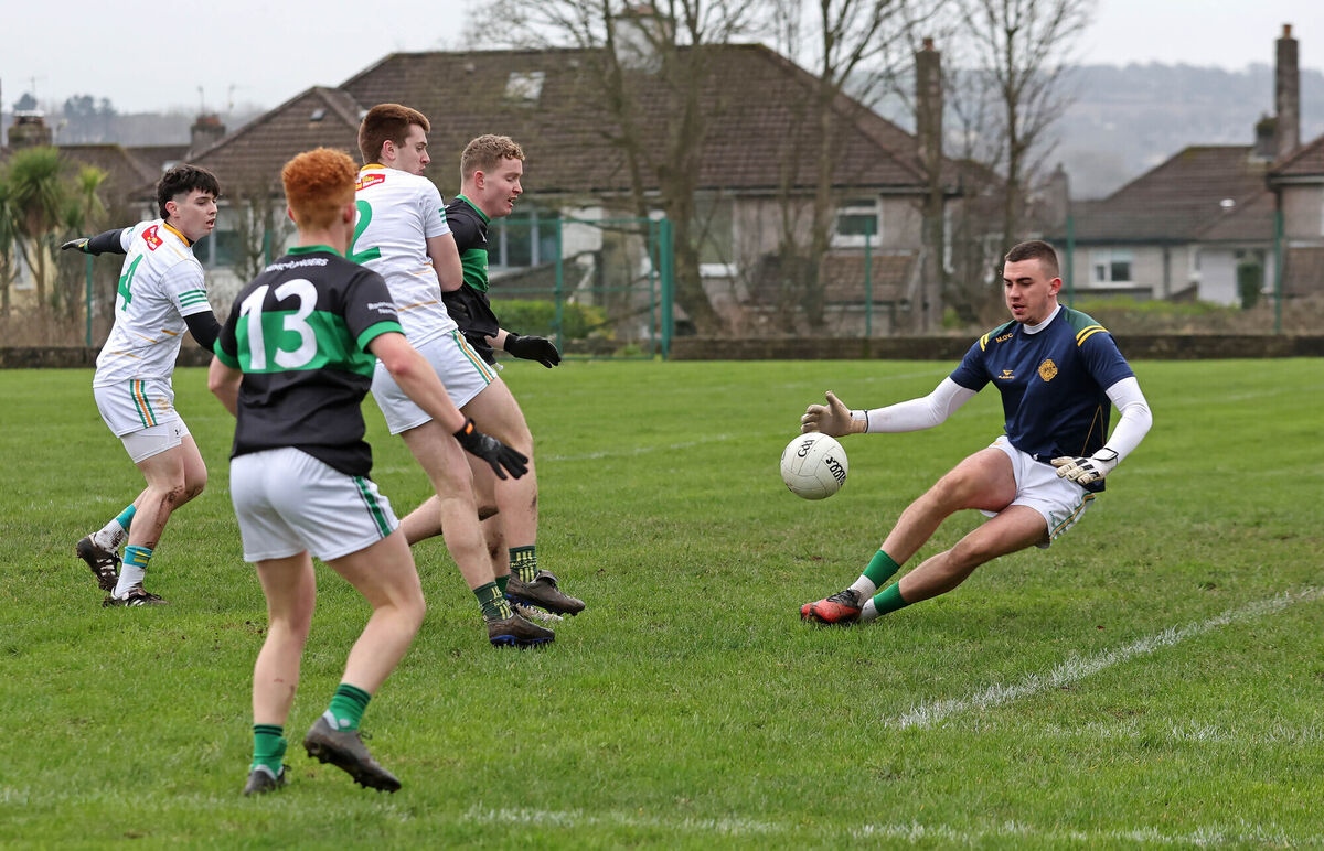  Dara O'Sullivan, Nemo Rangers, has his shot at goal saved by Mikey O'Connell, St Michael's, in the Pharmacare City Division U21 A FC semi-final at Ballinlough. Picture: Jim Coughlan.