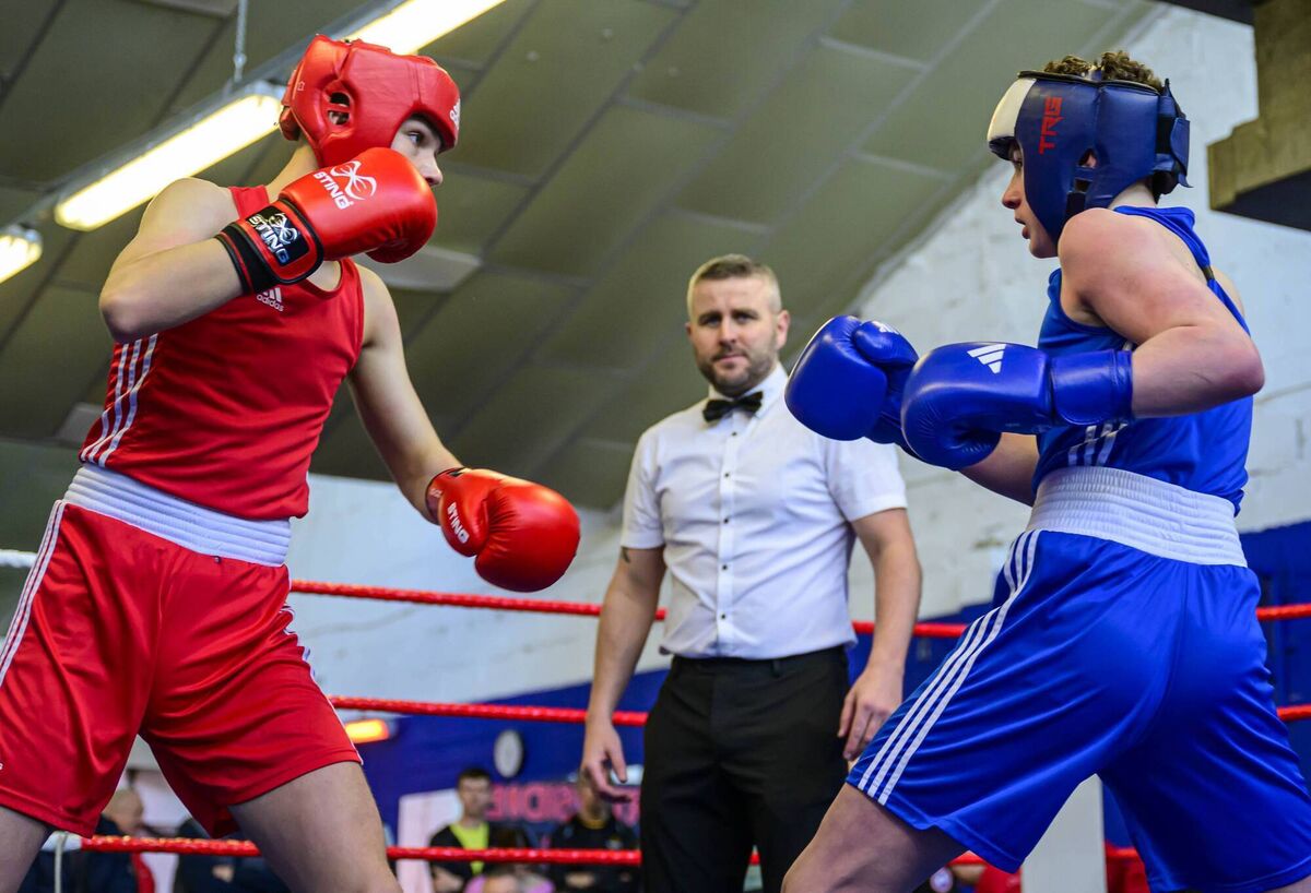 Kieron Murphy of Kanturk BC (Red) and Michael McDonagh of Mitchelstown in action during the recent Boy 4,5,6 Championships at Northside Boxing Club under the watchful eye of referee Danny Fitzpatrick. Picture: Doug Minihane Kieron Murphy of Kanturk BC (Red) and Michael McDonagh of Mitchelstown in action during the recent Boy 4,5,6 Championships at Northside Boxing Club under the watchful eye of referee Danny Fitzpatrick. Picture: Doug Minihane