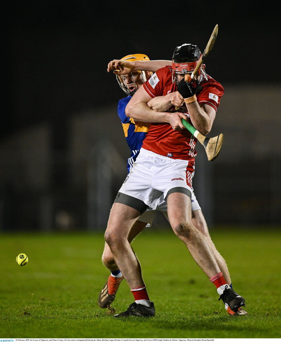 Joe Caesar of Tipperary and Ethan Twomey of Cork contest a dropping ball. Picture: Brendan Moran/Sportsfile