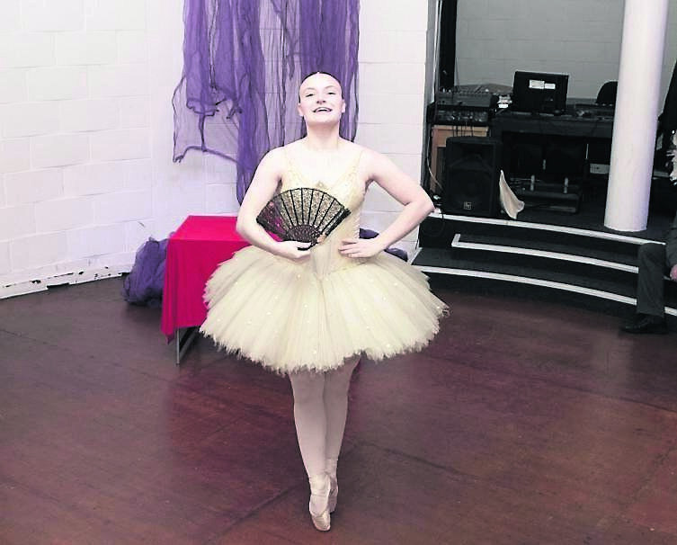 A member of the Joan Denise Moriarty School of Dance dances for the crowd.