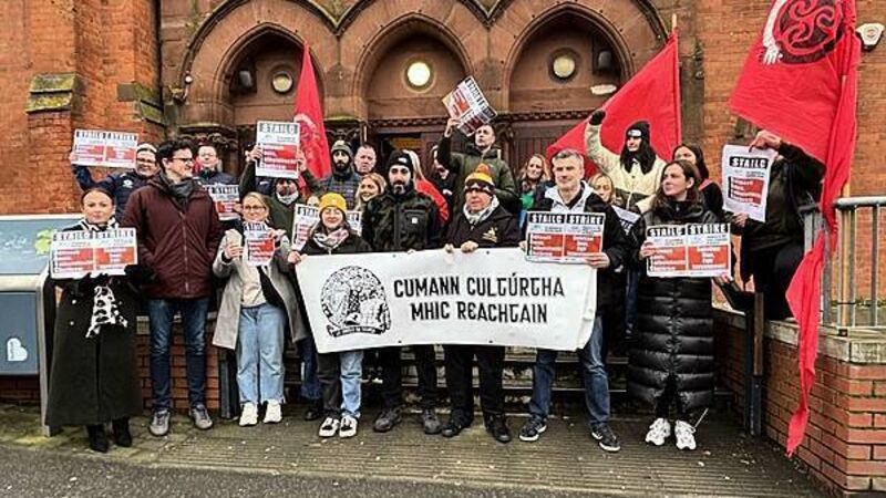 Irish language group workers strike over funding cuts Irish language group workers strike over funding cuts
