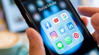 BANGKOK, THAILAND- 26 June 2019 : Hands of man use Iphone 7 plus with social media application of facebook, youtube, google sear
