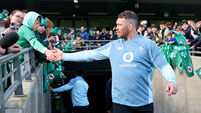 Peter O'Mahony high fives a young fan ahead of training 27/2/2025