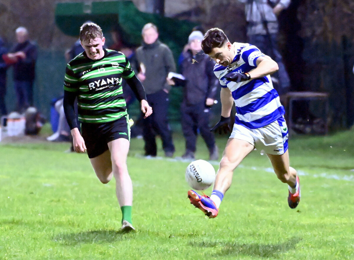 Castlehaven's Conor Nolan solos away from Douglas' Harry Qulligan. Picture: Eddie O'Hare
