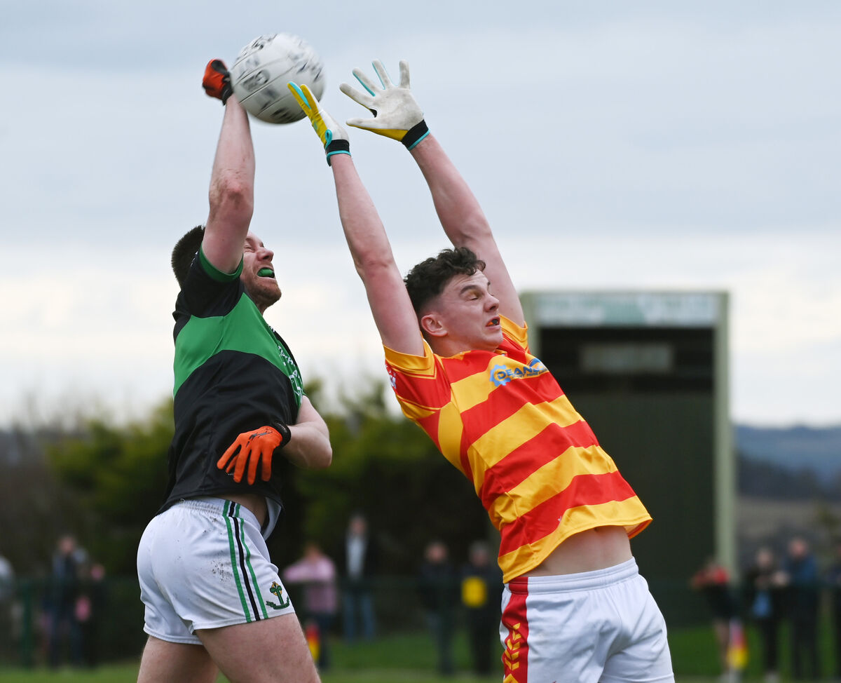Nemo Rangers' Alan O'Donovan goes high with Newcestown's Eoghan Collins. Picture: Eddie O'Hare Nemo Rangers' Alan O'Donovan goes high with Newcestown's Eoghan Collins. Picture: Eddie O'Hare
